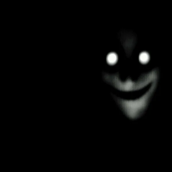 creepy-looking-figure-smiling-dark-600nw-2348912379.jpg