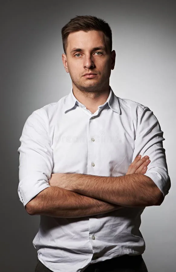 portrait-serious-man-shirt-against-grey-background-34468874-1878675784.jpg portrait-serious-man-shirt-against-grey-background-34468874-1878675784.jpg